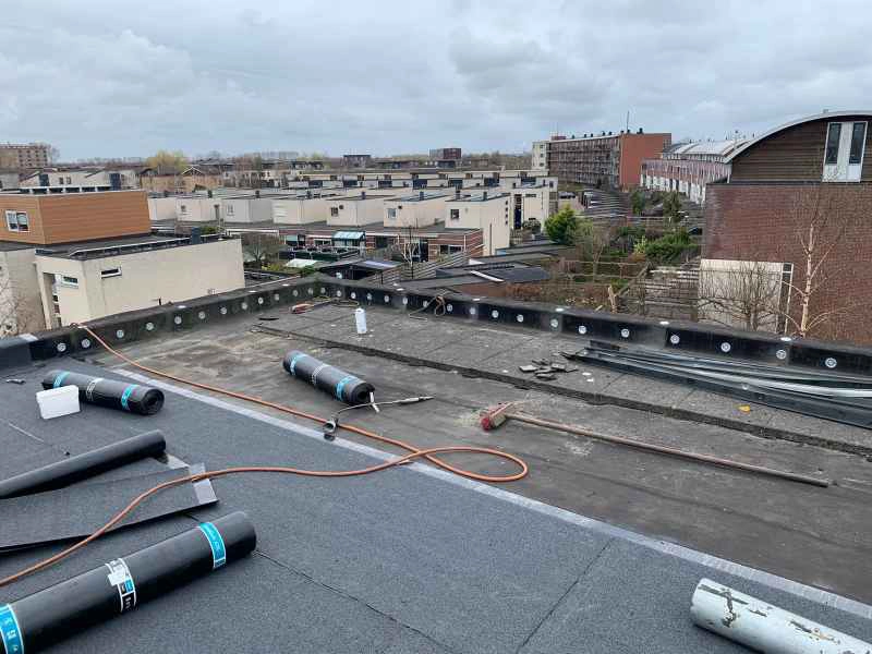 Platdak vernieuwen vervangen